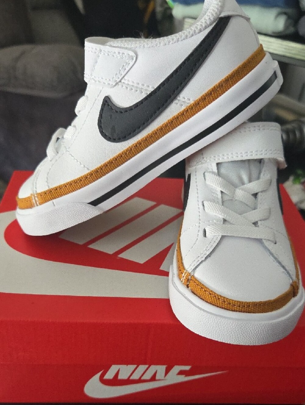 Nike Kids White Sneakers with Black Swoosh and Gold Accent - Picture 4 of 8